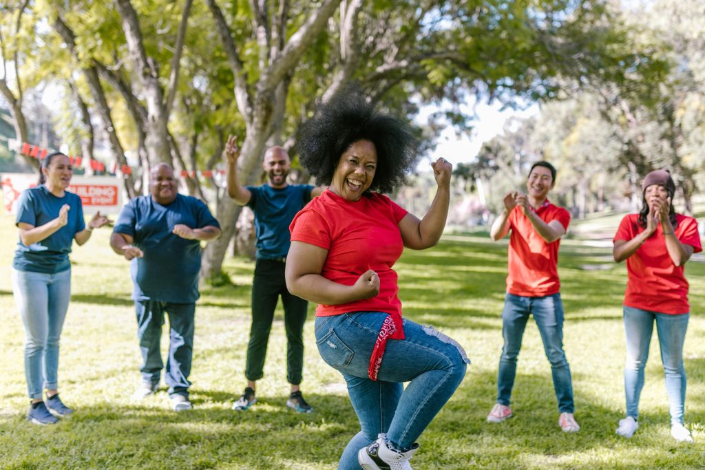 Pexels rdne Photo by RDNE Stock project: https://www.pexels.com/photo/woman-dancing-in-red-t-shirt-and-blue-denim-jeans-7551261/
